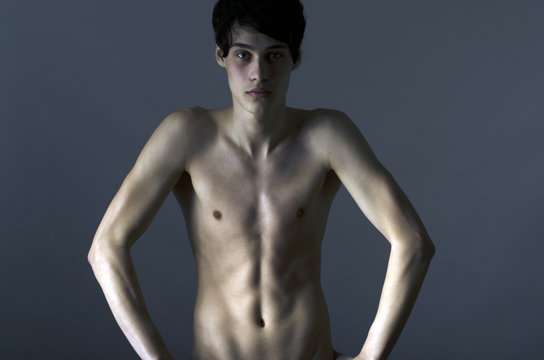 Skinny young man posing fashion, anorexic look, slim body