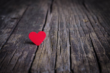 Fototapeta premium Red heart on wooden background