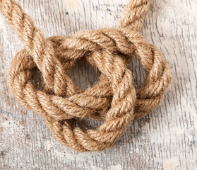 marine knot on the old wooden background