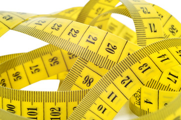 Yellow tape measure isolated on white.