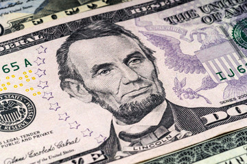 Portrait of Lincoln in front of the dollar bill