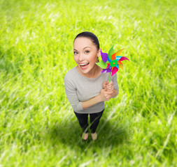 smiling asian woman with windmill