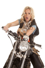 Fototapeta na wymiar woman on motorcycle with kangaroo shocked