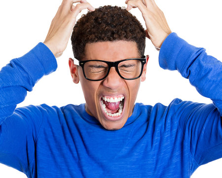 Young stressed man having  bad headache, migraine 