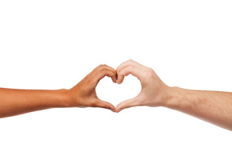 woman and man hands showing heart shape