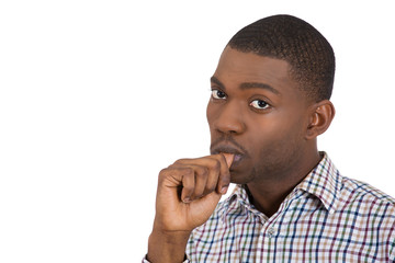Clueless thinking man with finger in mouth, sucking thumb