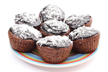 Fresh baked chocolate muffin with desiccated coconut
