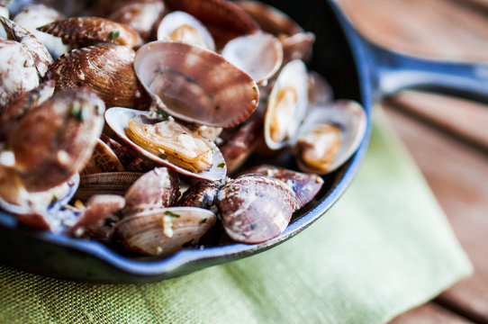 Cast Iron Skillet Of Delicious Fresh Steamer Clams With Garlic A