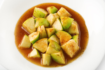 Green apples with honey and cinnamon  isolated on white