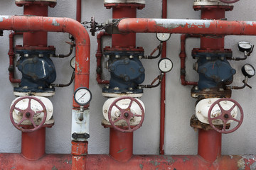 Red pipes with valves and manometers