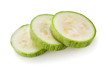 Piece of courgette or zucchini on a white background