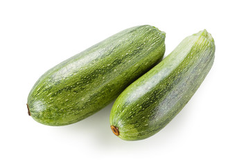 Two fresh green zucchini isolated on white background