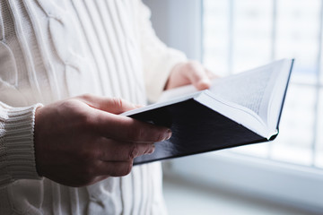 Man reading. Book in his hands.