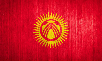 Kyrgyzstan Flag on wood background