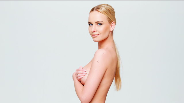 Young Naked Woman Cover Her Breast With Hands