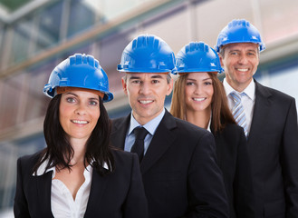 Happy Architects Standing In A Row