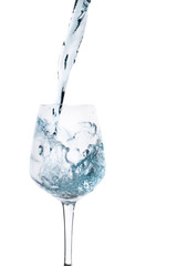 Water splashing in a glass, isolated on white background
