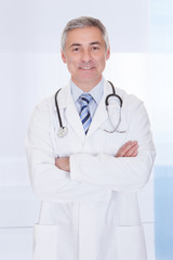 Portrait Of Happy Mature Male Doctor