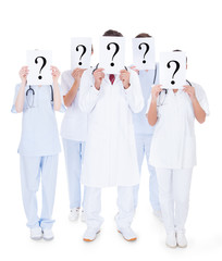Group Of Doctors With Question Mark Sign