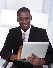 African Businessman Holding Digital Tablet