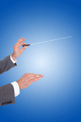Person Directing With A Conductor's Baton