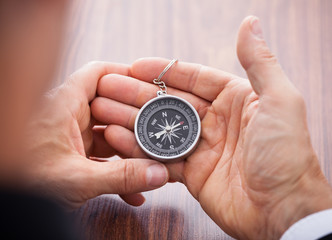 Hand Holding Compass