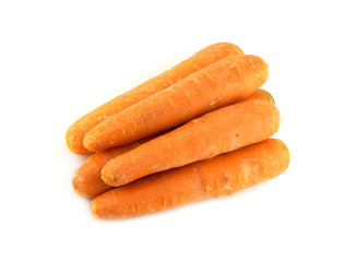 Five ripe washed fresh red carrots isolated diagonal view
