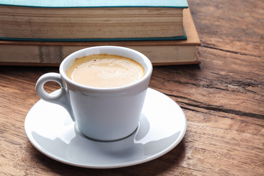 espresso and books on table