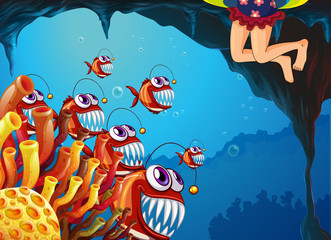 Obraz premium A group of fish watching the young girl