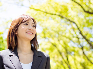 young asisn businesswoman in the park
