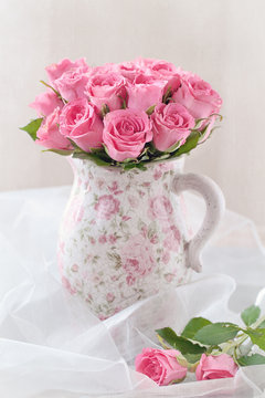 fresh pink roses in a ceramic vase
