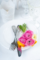 Festive table setting with flowers