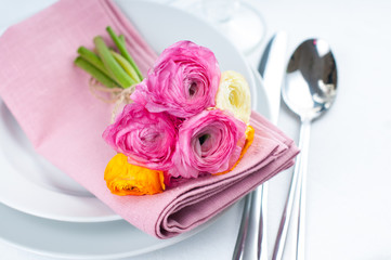 Festive table setting with flowers