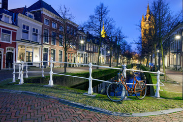 Retro bicycle, the old church and canal in Delft, The Netherland