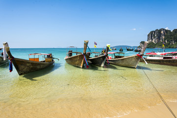 Fototapeta na wymiar Longtail boats in Railay beach, Krabi peninsula in Thailand