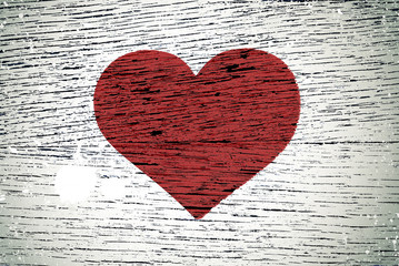 painting love symbol on old wooden wall