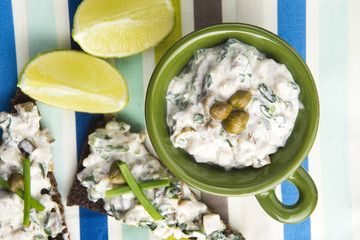 sandwiches with dark bread, herrings, mushrooms, pepper