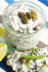 sandwiches with dark bread, herrings, mushrooms, pepper