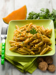 pasta with pumpkin sauce and parsley, selective focus