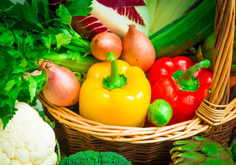 colored peppers in wicker basket