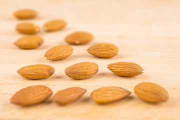 Almonds on wooden background