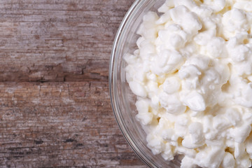 cottage cheese in a bowl macro. view from above. Horizontal