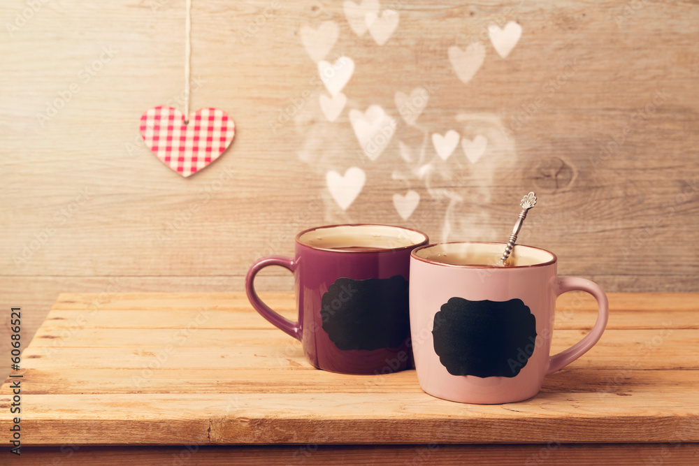 Wall mural cup of tea with chalkboard stickers and heart bokeh