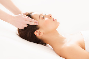 Face Massage. Close-up of a Young Woman Getting Spa Treatment.