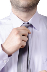 business man adjusting his neck tie