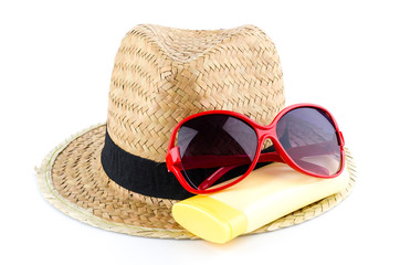 Hat , sunglasses , body lotion isolated on white background