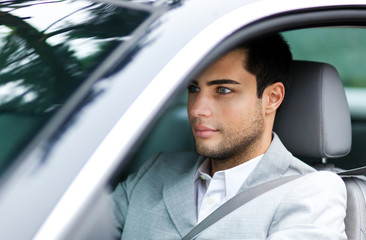 Portrait of a man driving a car