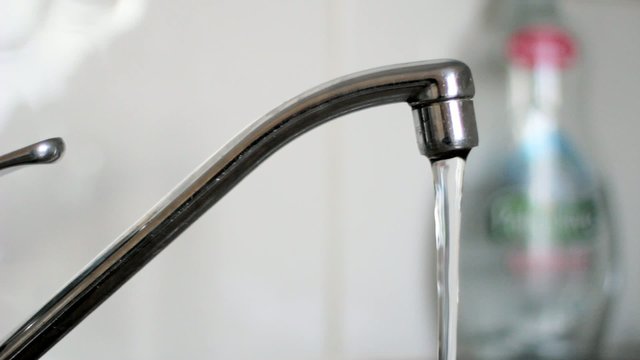 Water flowing from the tap