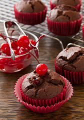 Chocolate muffins with cherry.