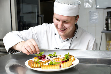 chef preparing food in the kitchen at the restaurant
